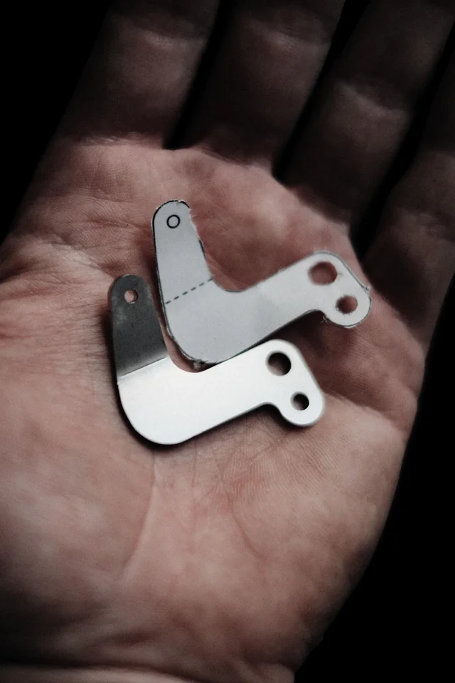 Small metal parts held in a hand